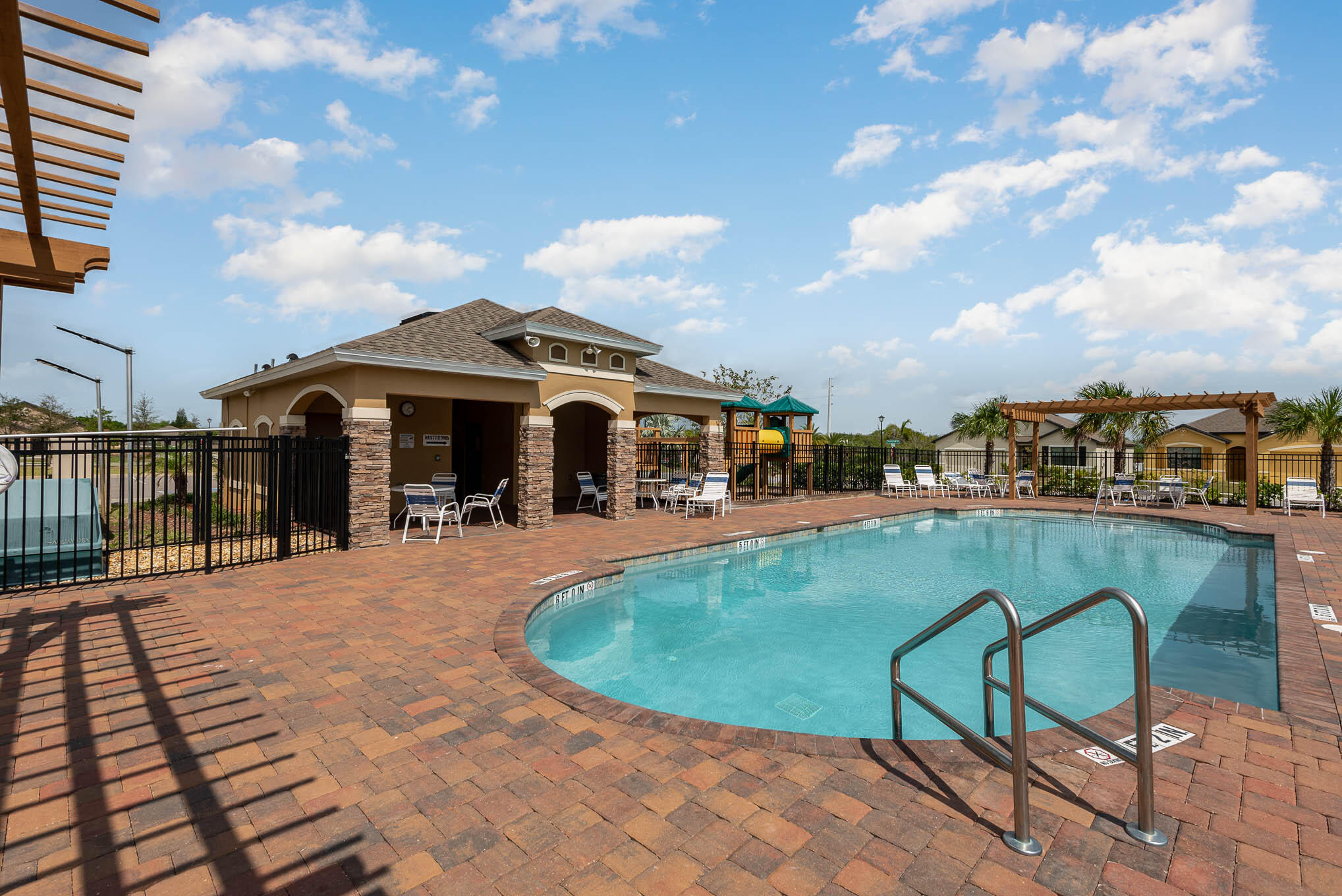 376 Snook Place Cocoa, FL 32927 - Photo 26 of 26 a view of a swimming pool and lounge chairs