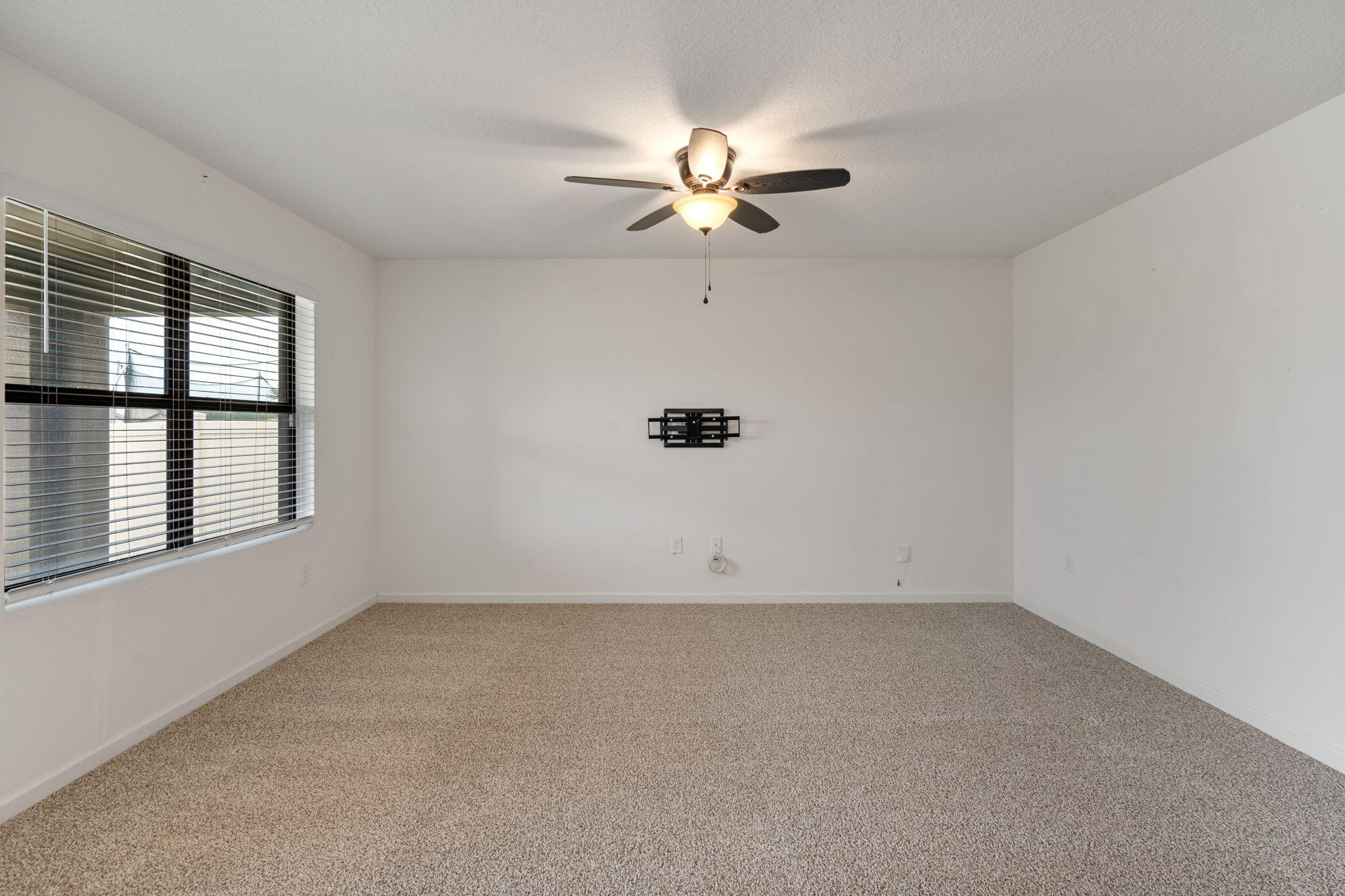 376 Snook Place Cocoa, FL 32927 - Photo 9 of 26 an empty room with windows and fan