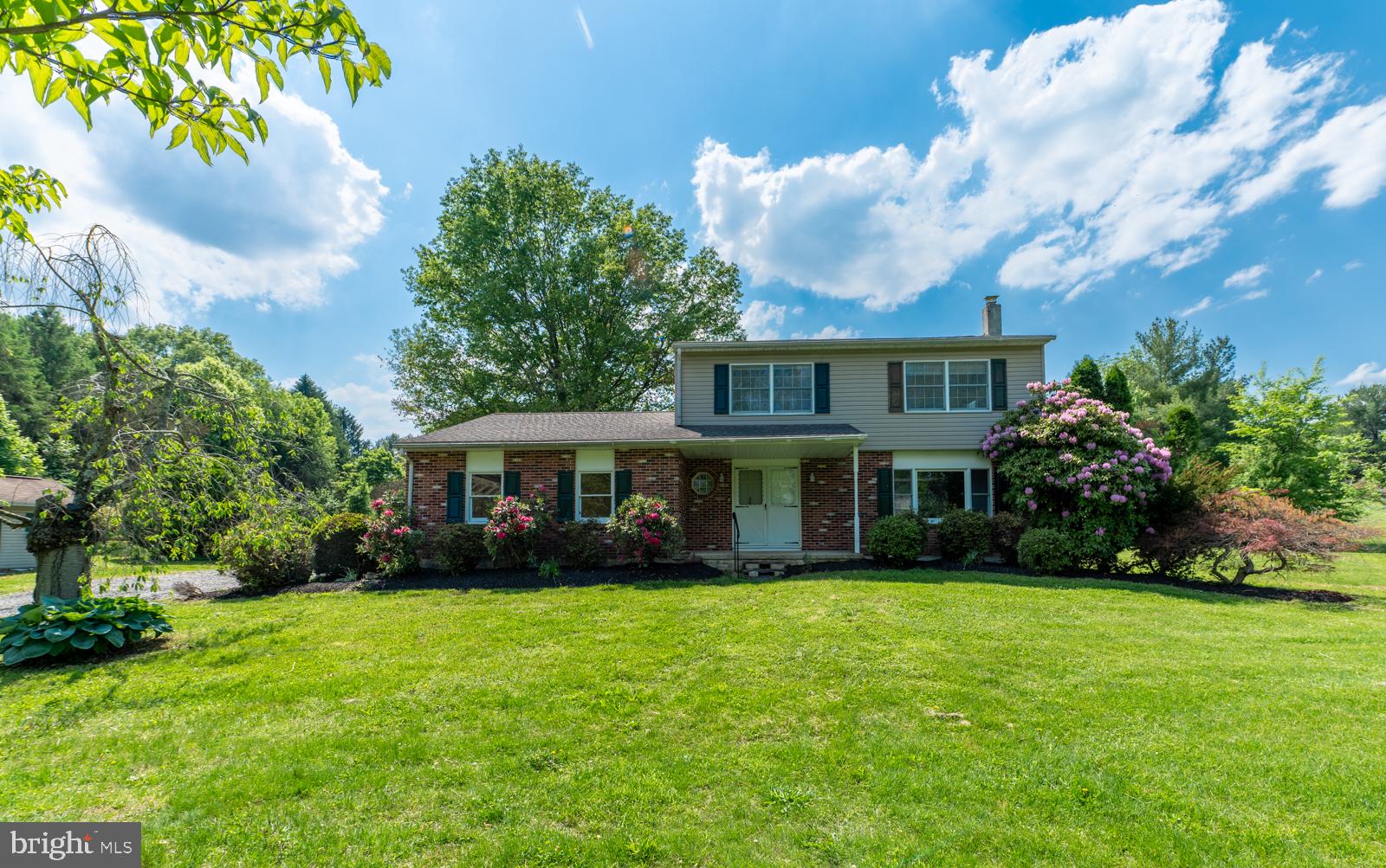 223 Trythall Road Elverson, PA 19520 - Photo 1 of 78 Charming home with lush greenery.
