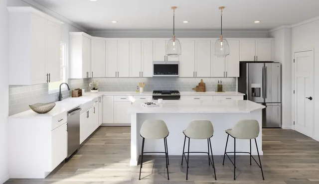 a kitchen with stainless steel appliances kitchen island granite countertop a sink a stove a refrigerator and white cabinets with wooden floor