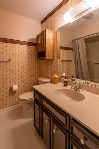an empty room with wooden floor and closet
