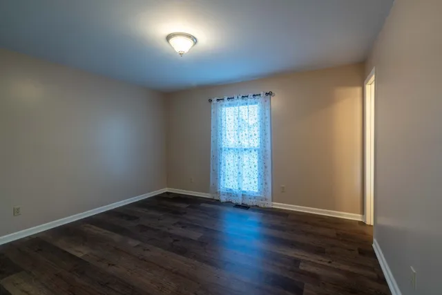 a bathroom with a sink toilet and mirror