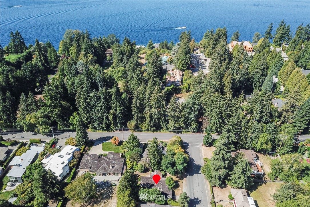7611 Northeast 12th Street Medina, WA 98039 - Photo 1 of 23 an aerial view of a house with a yard and lake view