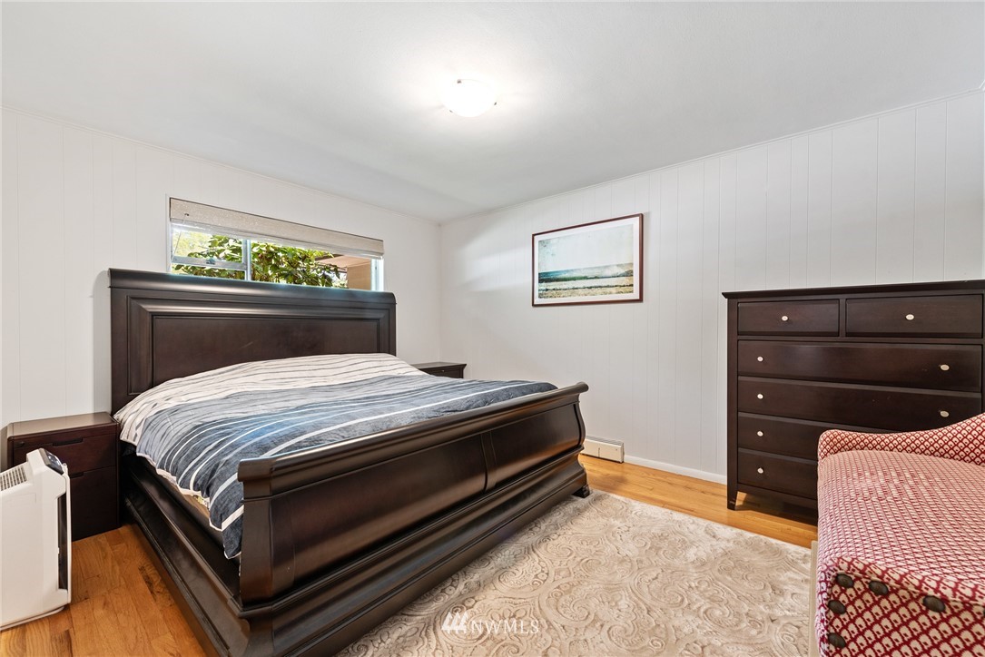 7611 Northeast 12th Street Medina, WA 98039 - Photo 13 of 23 a bedroom with a bed and a dresser
