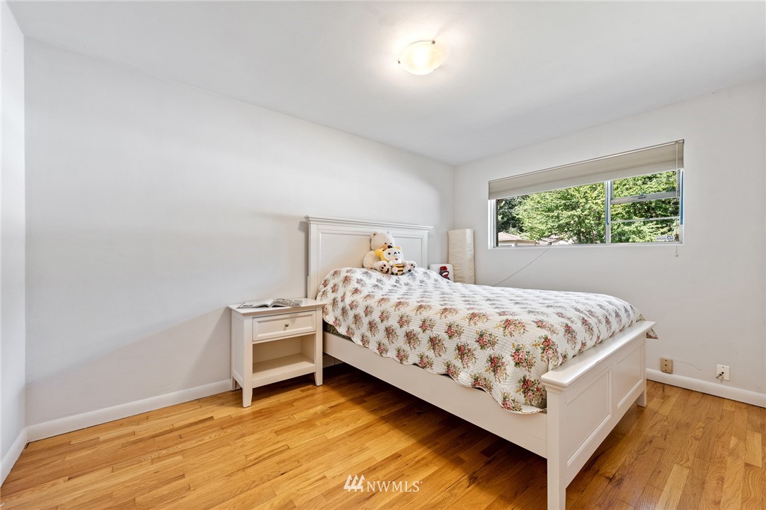7611 Northeast 12th Street Medina, WA 98039 - Photo 14 of 23 a bedroom with a bed and window