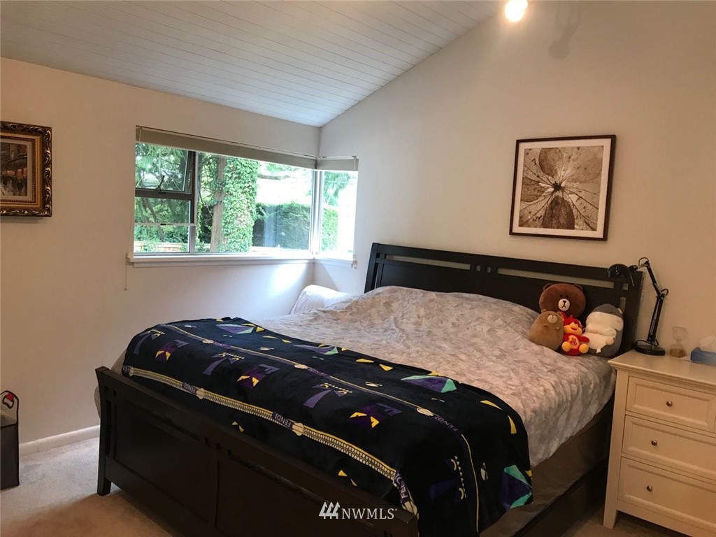 7611 Northeast 12th Street Medina, WA 98039 - Photo 15 of 23 a bedroom with a bed and window