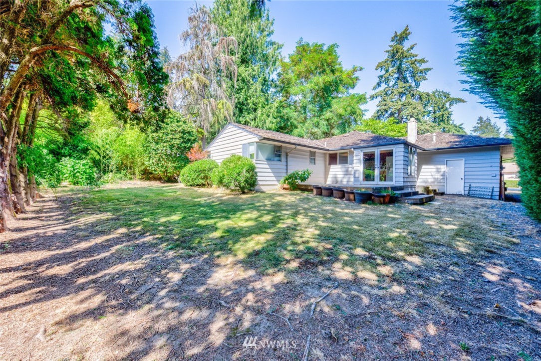 7611 Northeast 12th Street Medina, WA 98039 - Photo 22 of 23 a house view with a garden space