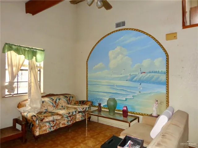 a living room with furniture and a window