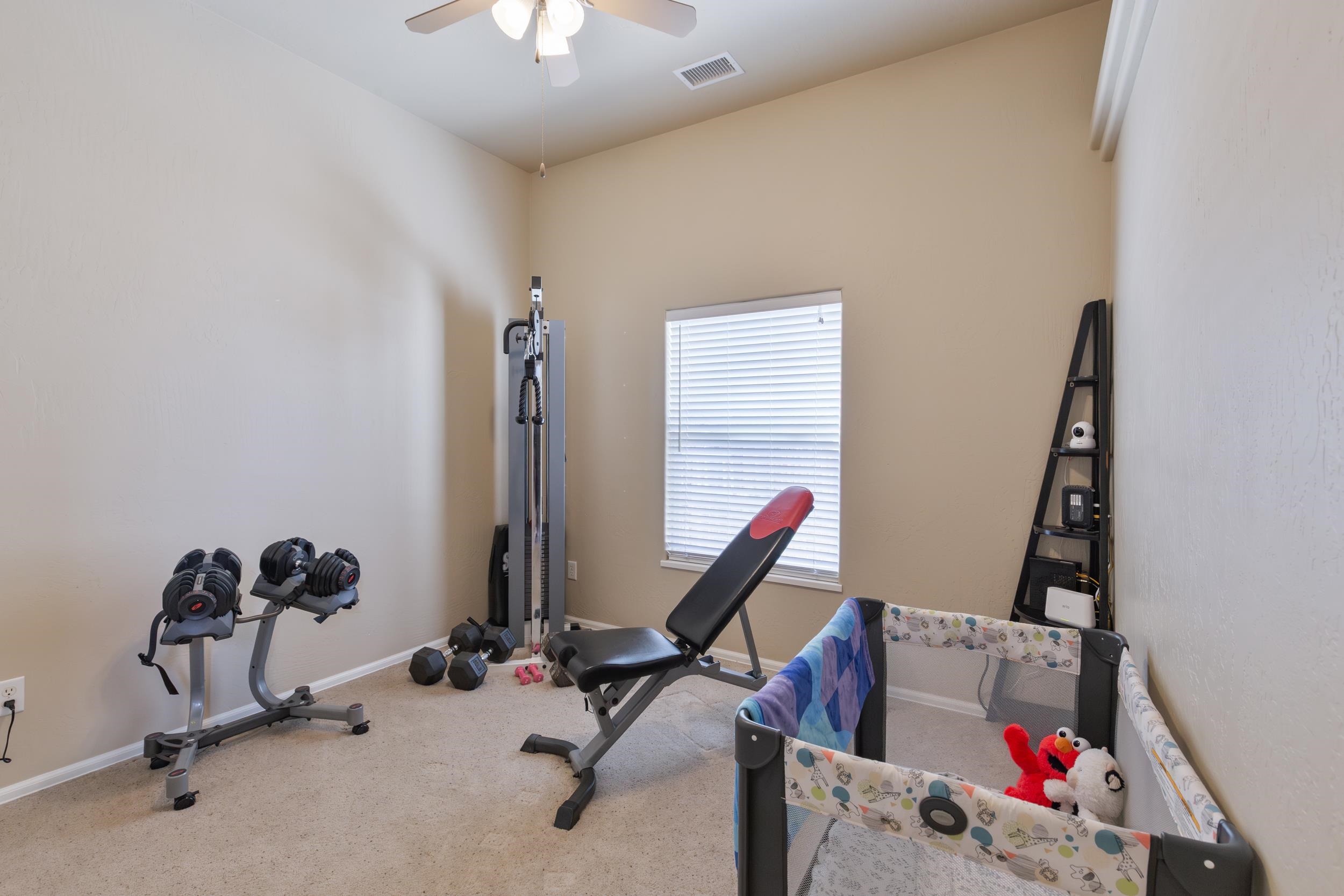 544 Hemlock Drive Fruita, CO 81521 - Photo 15 of 36 a view of a room with gym equipment