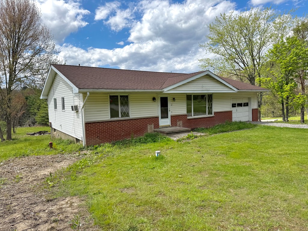 527 Heckathorn Church Road Seneca, PA 16346 - Photo 2 of 13 a front view of a house with a yard