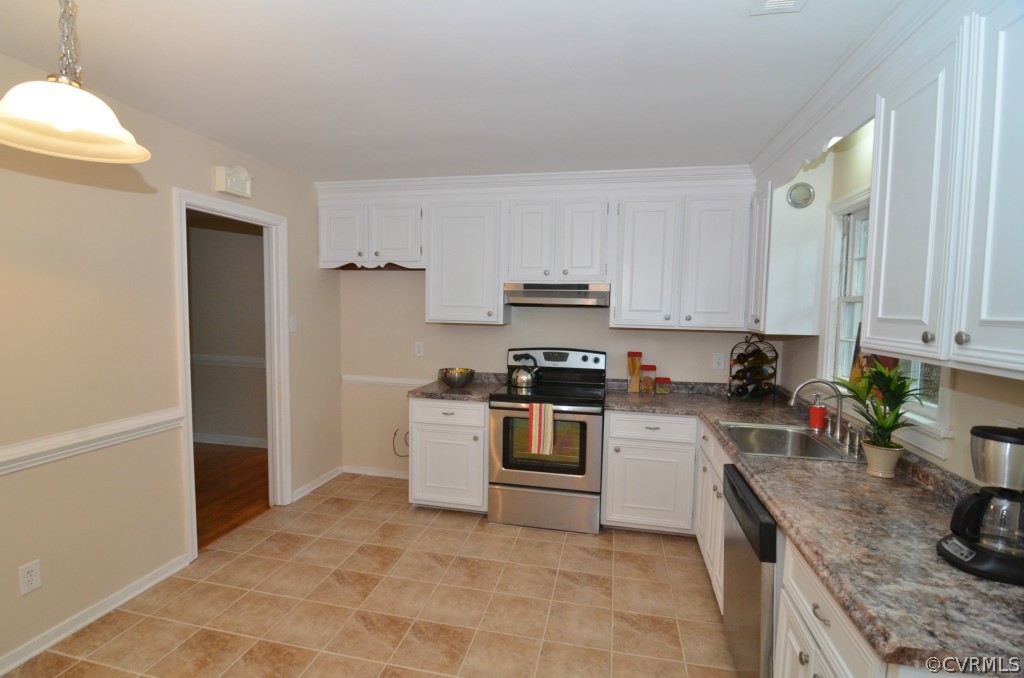 250 Philray Road North Chesterfield, VA 23236 - Photo 3 of 22 a kitchen with a sink a stove and cabinets