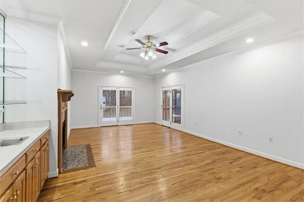 a kitchen with granite countertop cabinets stainless steel appliances a sink and a window