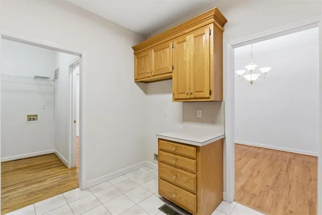 a view of a kitchen with a stove cabinets