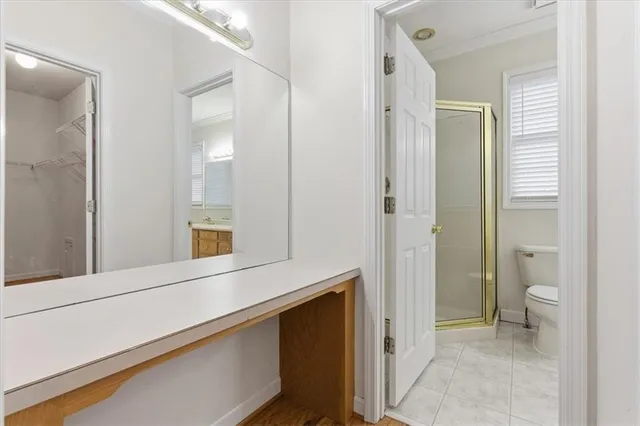 a bathroom with a shower and a toilet