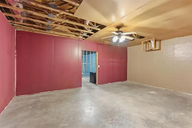 a view of empty room with wooden walls