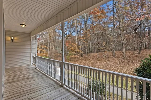 a view of balcony with wooden floor