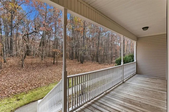 a view of balcony with wooden floor