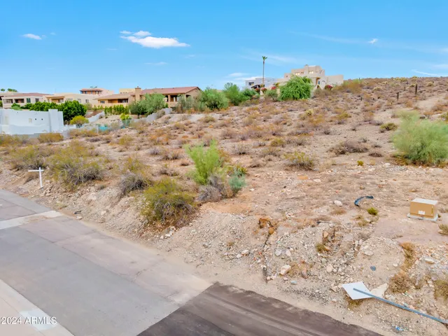 a view of a road with a building in the background
