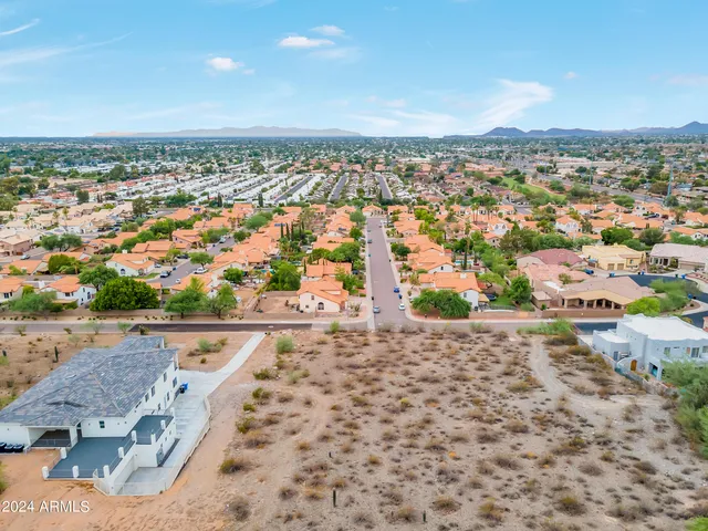 an aerial view of residential building and parking space