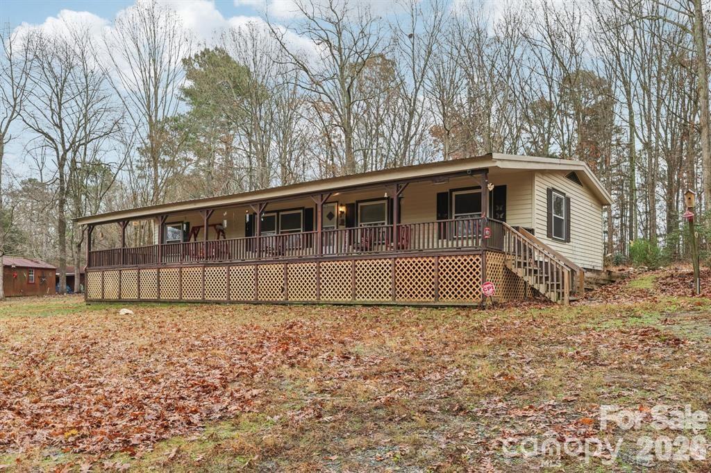 920 Dewitt Helms Road Monroe, NC 28112 - Photo 24 of 47 a view of a house with a yard
