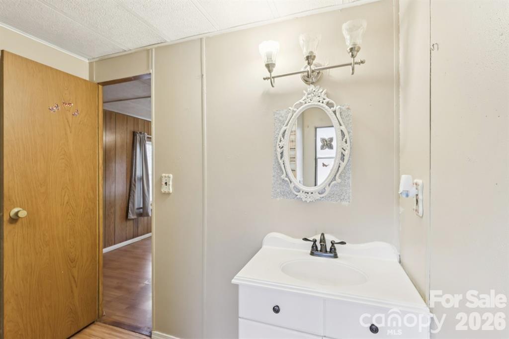 920 Dewitt Helms Road Monroe, NC 28112 - Photo 32 of 47 a bathroom with a sink and a mirror