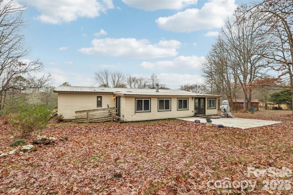 920 Dewitt Helms Road Monroe, NC 28112 - Photo 35 of 47 a house that has a lot of windows in it