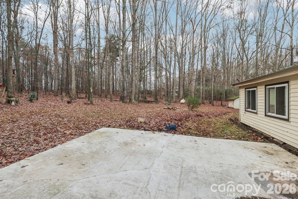 920 Dewitt Helms Road Monroe, NC 28112 - Photo 37 of 47 a view of a backyard with large trees