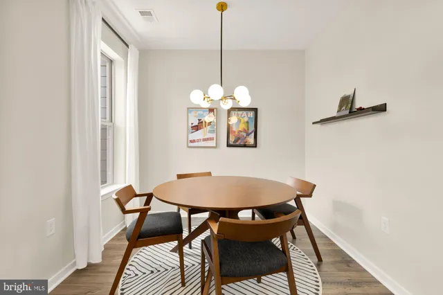 a dining room with furniture and window