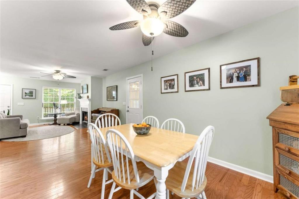 7210 Fields Drive Cumming, GA 30041 - Photo 18 of 58 a view of a dining room with furniture window and wooden floor