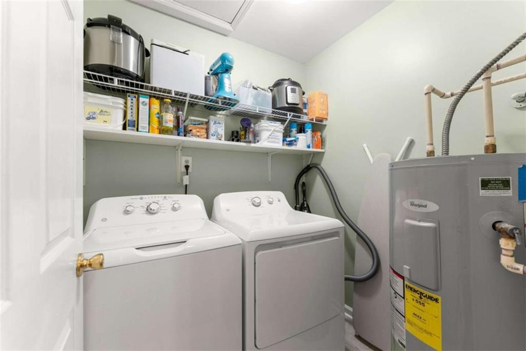 7210 Fields Drive Cumming, GA 30041 - Photo 23 of 58 a utility room with dryer and washer