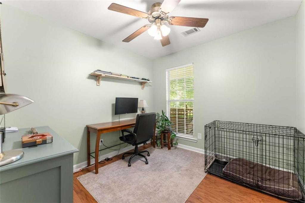 7210 Fields Drive Cumming, GA 30041 - Photo 24 of 58 a view of a workspace with furniture and a window