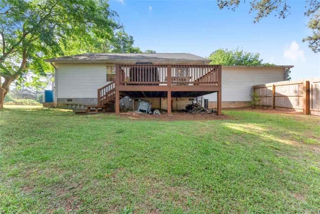 7210 Fields Drive Cumming, GA 30041 - Photo 37 of 58 a view of a house with a yard and sitting area