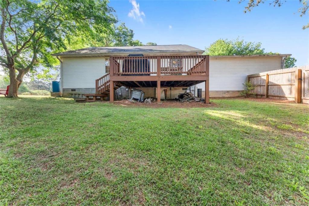 7210 Fields Drive Cumming, GA 30041 - Photo 38 of 58 a view of a house with a backyard and a patio