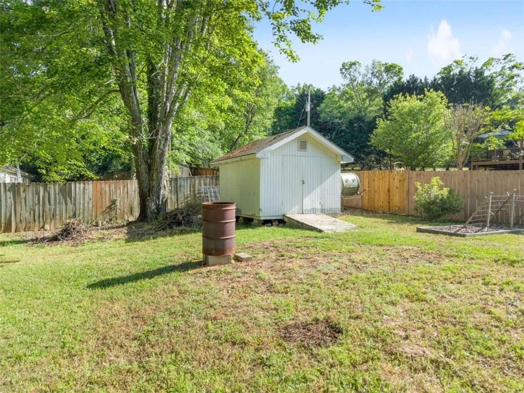 7210 Fields Drive Cumming, GA 30041 - Photo 40 of 58 a view of a house with backyard and trees