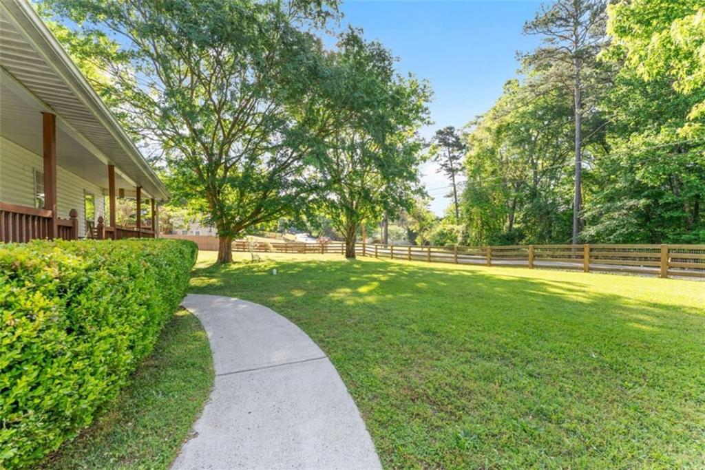 7210 Fields Drive Cumming, GA 30041 - Photo 4 of 58 a view of a park with large trees