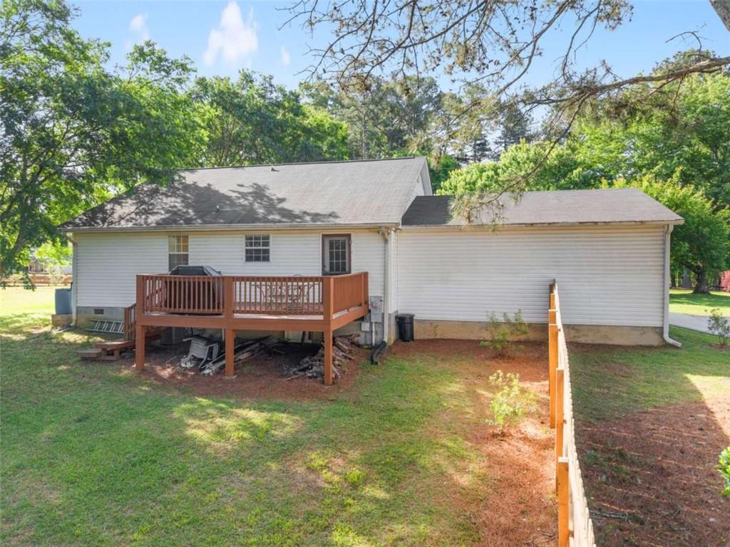 7210 Fields Drive Cumming, GA 30041 - Photo 5 of 58 a backyard of a house with yard and outdoor seating