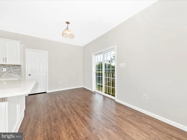 a kitchen with appliances and cabinets