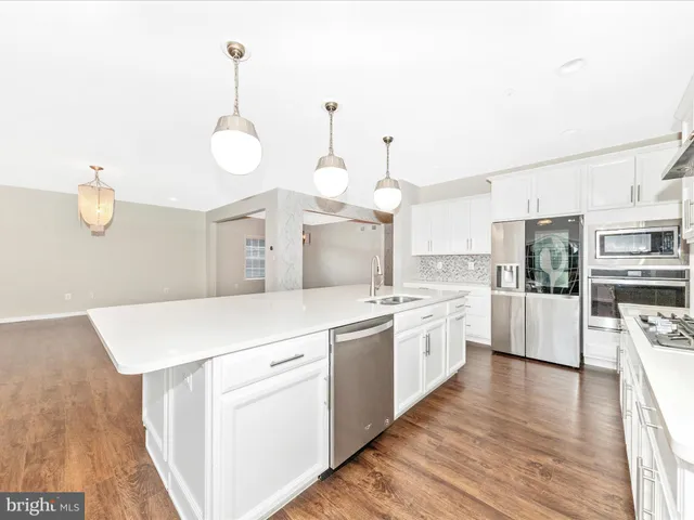 a view of a livingroom with a ceiling fan and window