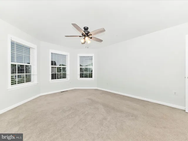 a view of a room with wooden floor and stairs