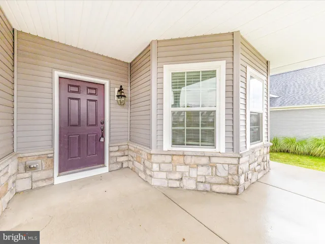 a view of a swimming pool and lounge chair