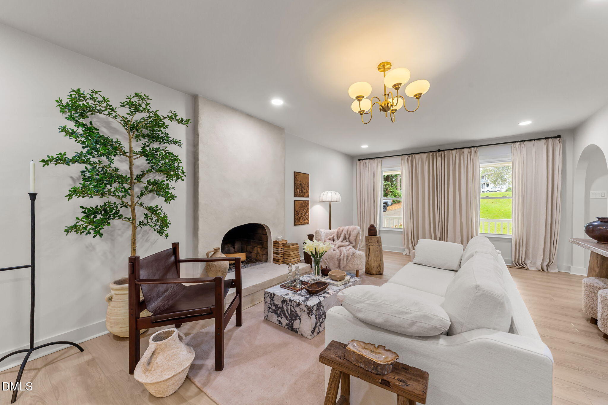 623 Canady Court Willow Spring, NC 27592 - Photo 18 of 42 a living room with furniture potted plant and a window