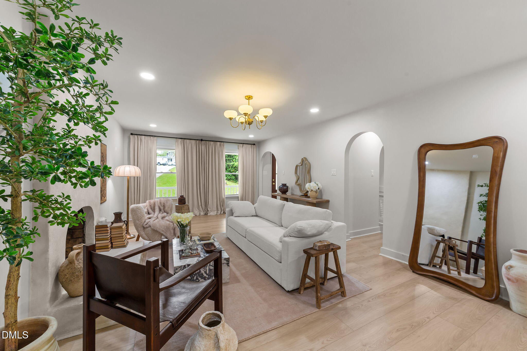 623 Canady Court Willow Spring, NC 27592 - Photo 19 of 42 a living room with furniture and a mirror