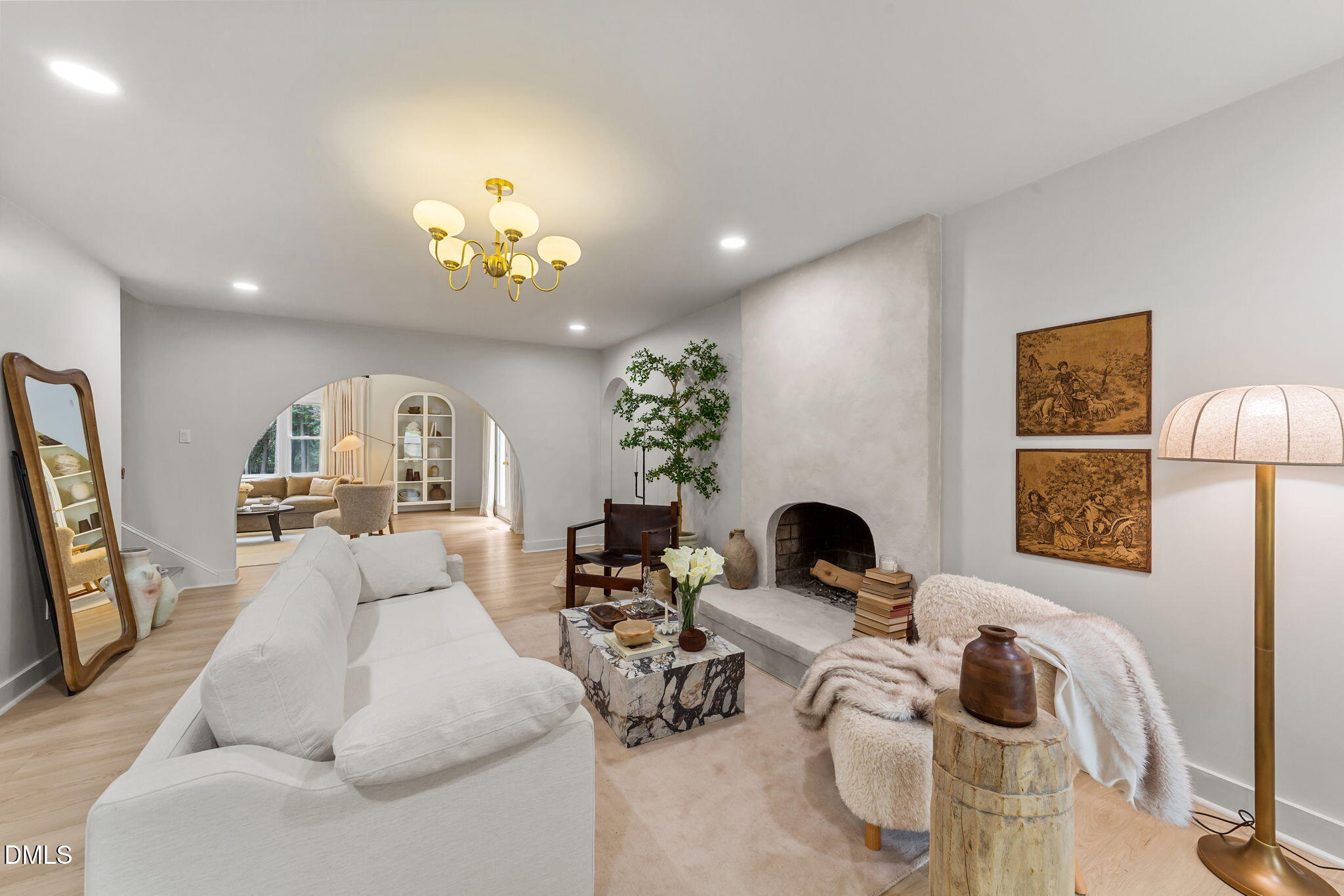 623 Canady Court Willow Spring, NC 27592 - Photo 20 of 42 a living room with furniture and a chandelier
