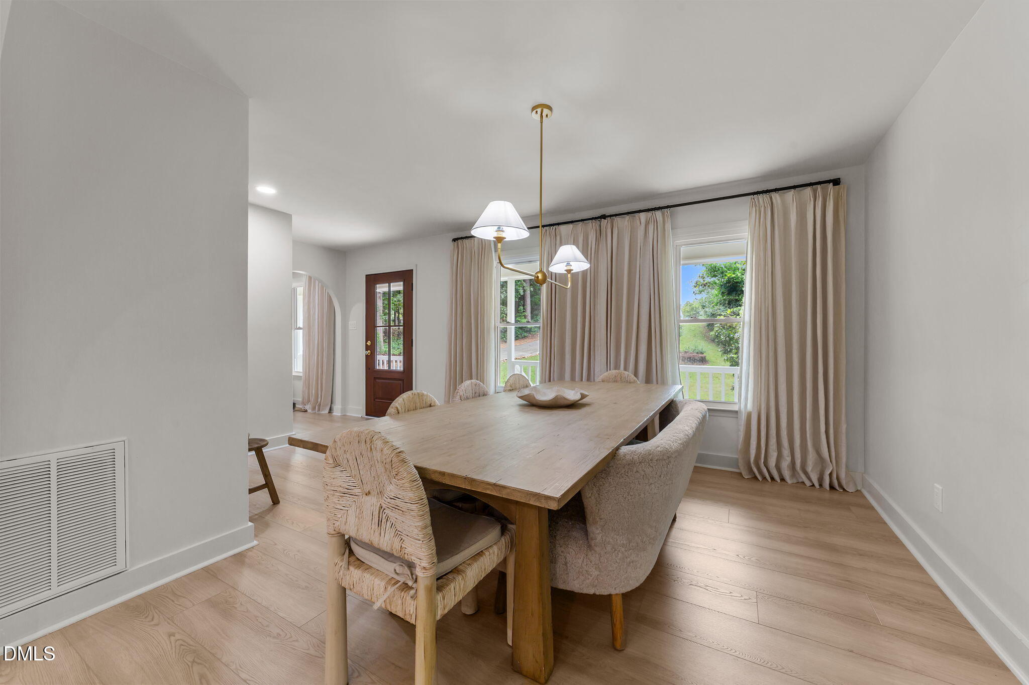 623 Canady Court Willow Spring, NC 27592 - Photo 23 of 42 a view of a dining room with furniture window and wooden floor