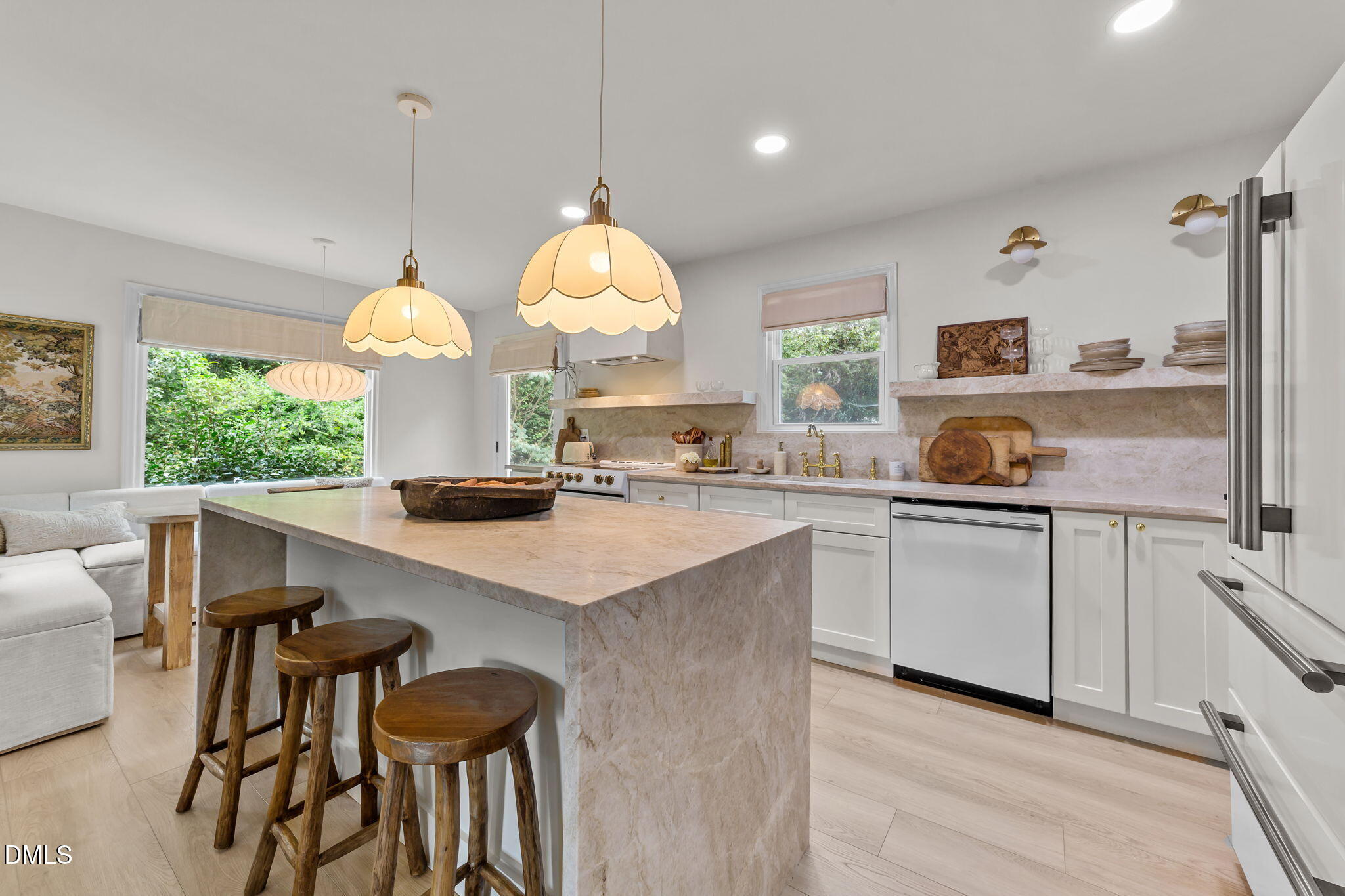 623 Canady Court Willow Spring, NC 27592 - Photo 24 of 42 a kitchen with a sink a center island and cabinets