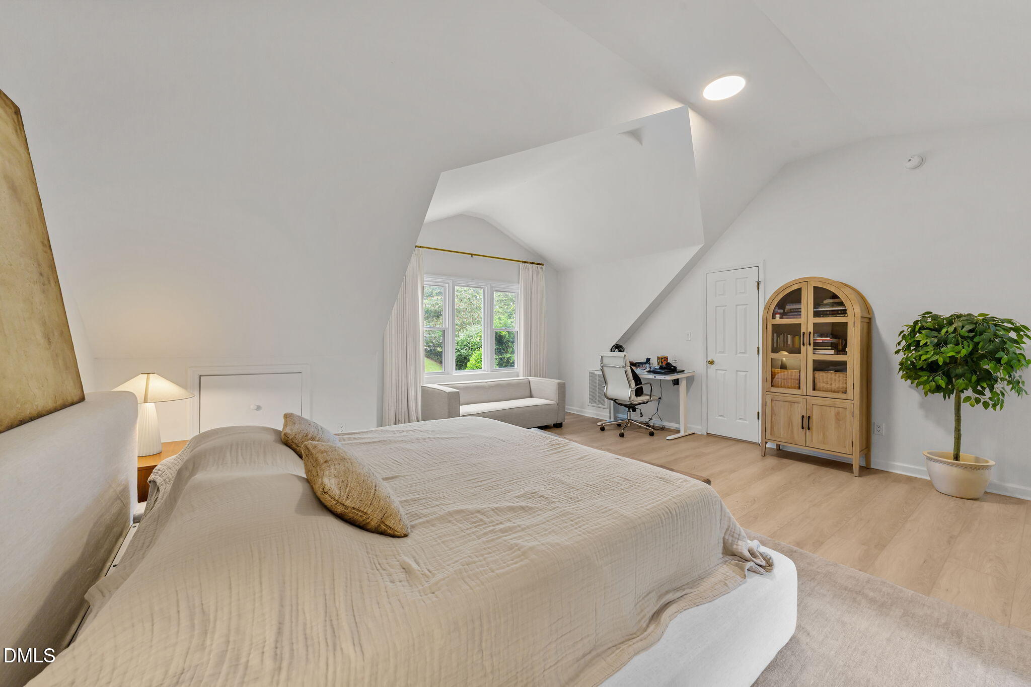 623 Canady Court Willow Spring, NC 27592 - Photo 33 of 42 a bedroom with a bed and a large window