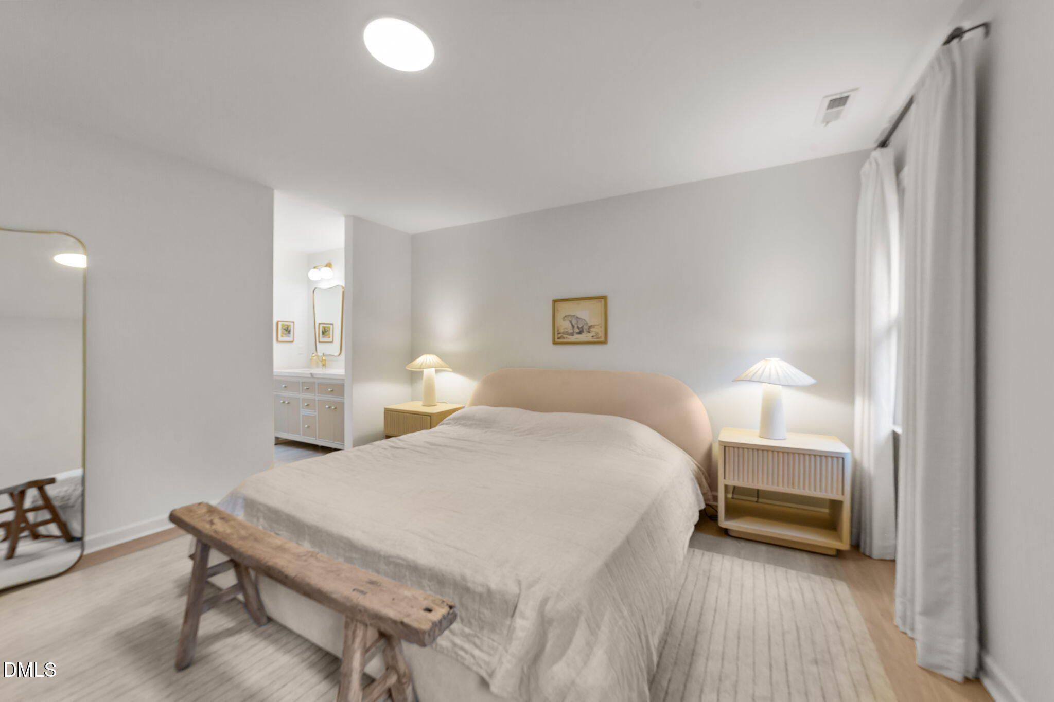 623 Canady Court Willow Spring, NC 27592 - Photo 40 of 42 a bedroom with a bed and a lamp