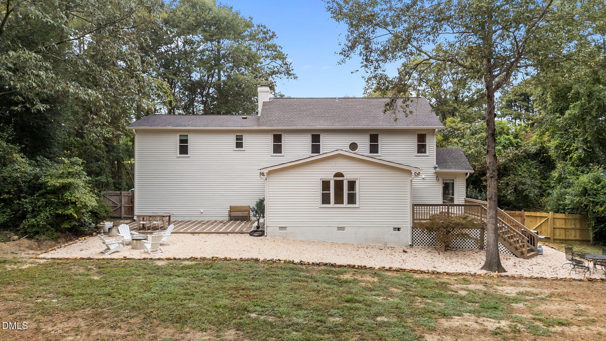623 Canady Court Willow Spring, NC 27592 - Photo 5 of 42 a view of a yard in front of a house with large windows