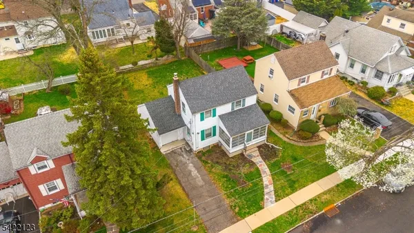 an aerial view of residential building with parking