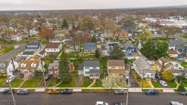 an aerial view of residential building and lake